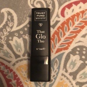 Trust Fund Beauty highlighter stick.